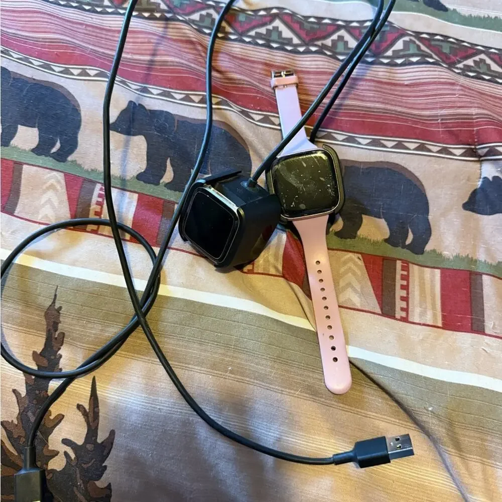 Pair of Fitbit Versa and Fitbit Versa 2, 2 chargers, 2 screen protectors, bands